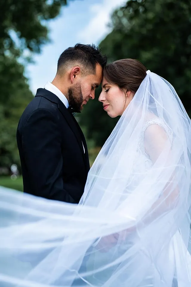 Bride and groom under the veil